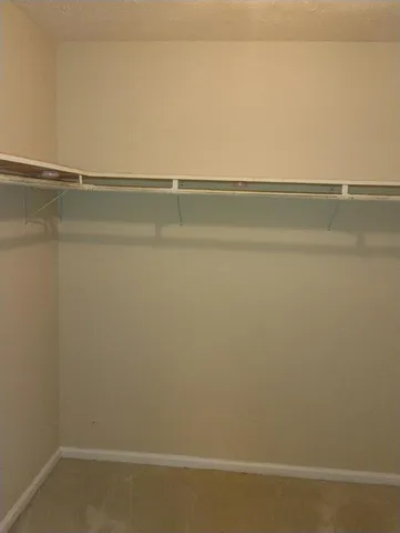 a view of an empty walk in closet