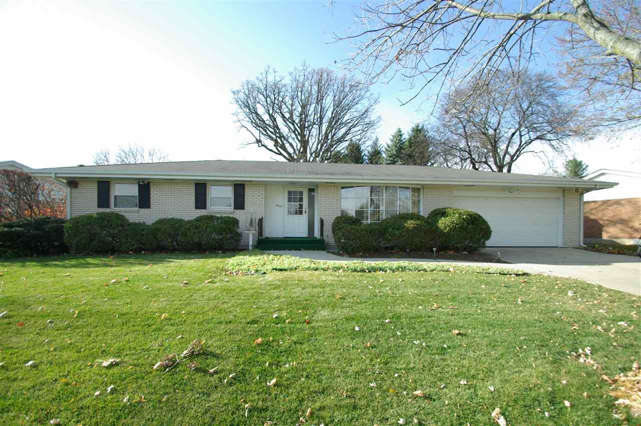 5460 Brookview Road Rockford, IL 61107 - Photo 1 of 20 a front view of a house with garden