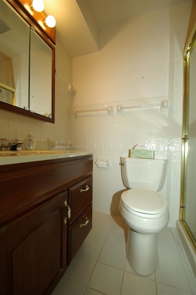 5460 Brookview Road Rockford, IL 61107 - Photo 11 of 20 a bathroom with a toilet sink and mirror