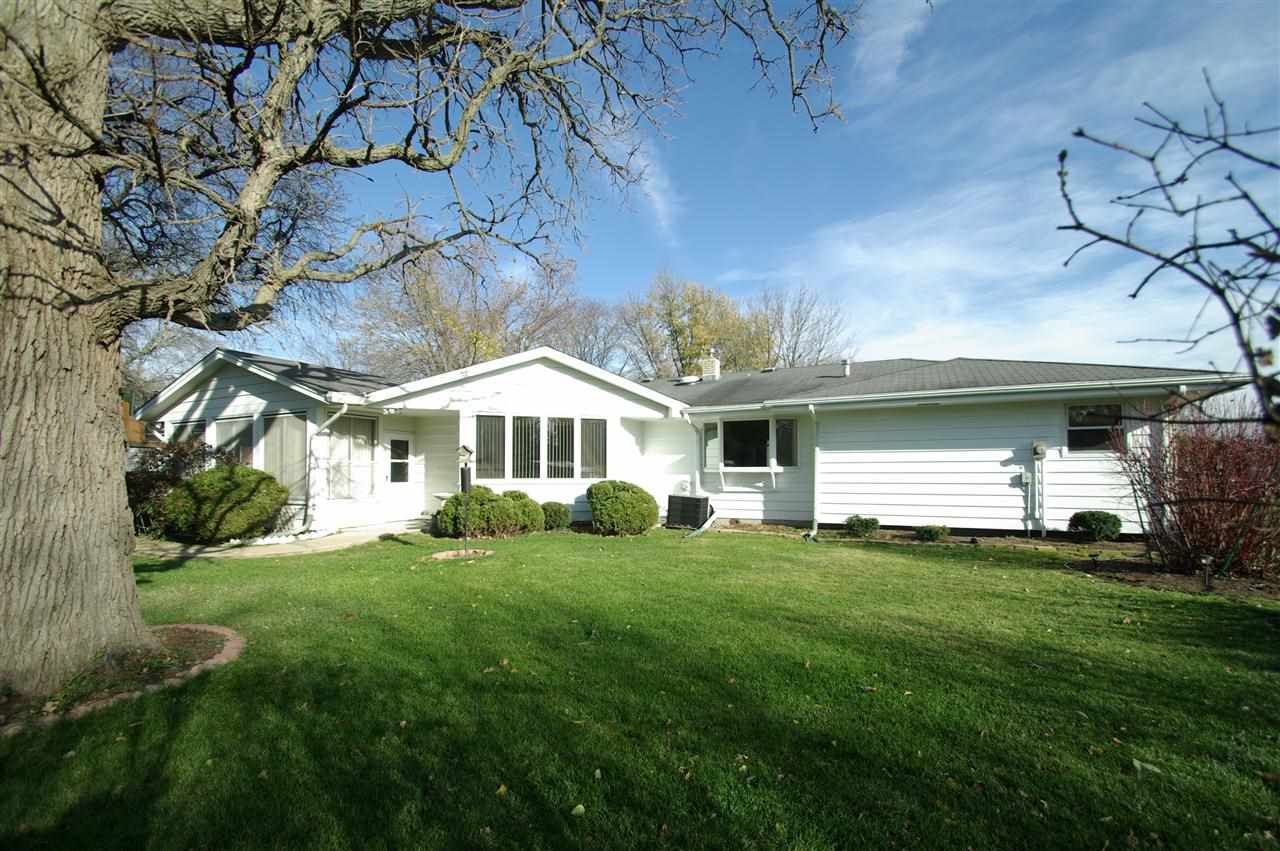 5460 Brookview Road Rockford, IL 61107 - Photo 19 of 20 a front view of a house with a yard and garage