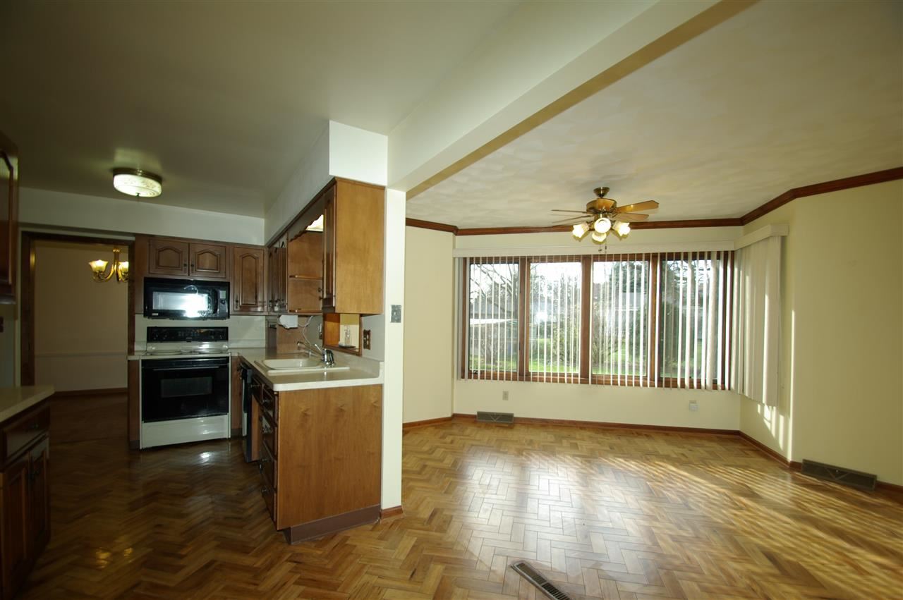 5460 Brookview Road Rockford, IL 61107 - Photo 5 of 20 a view of a kitchen with a stove top oven