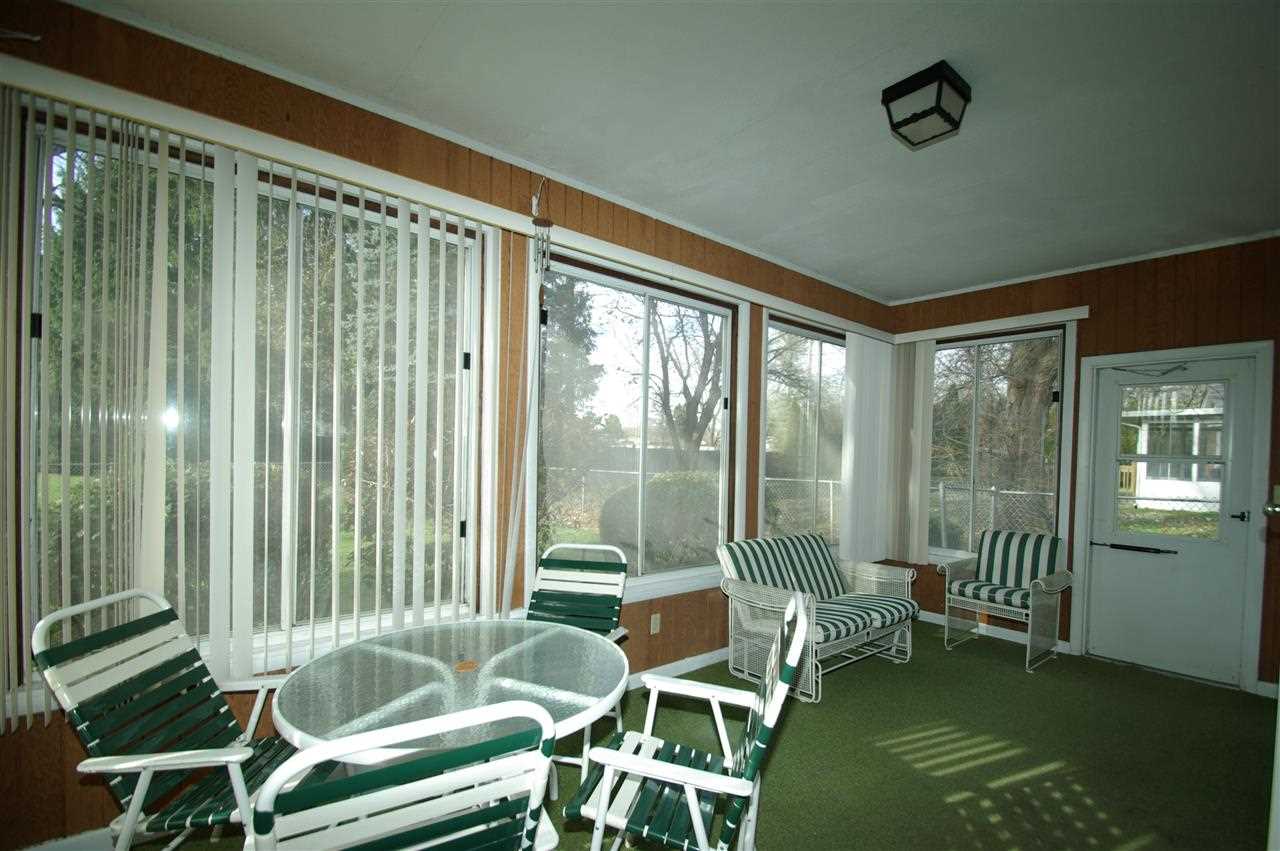5460 Brookview Road Rockford, IL 61107 - Photo 9 of 20 a balcony with chairs and table