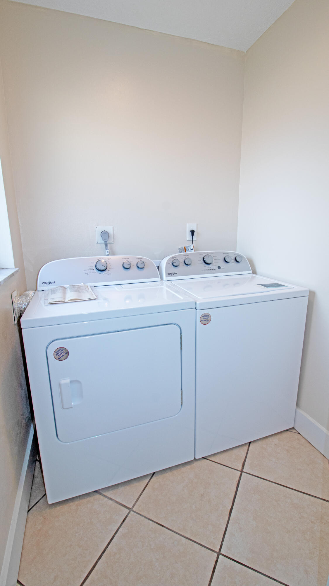 8757 Southeast Hobe Ridge Avenue Hobe Sound, FL 33455 - Photo 15 of 29 a utility room with dryer and washer