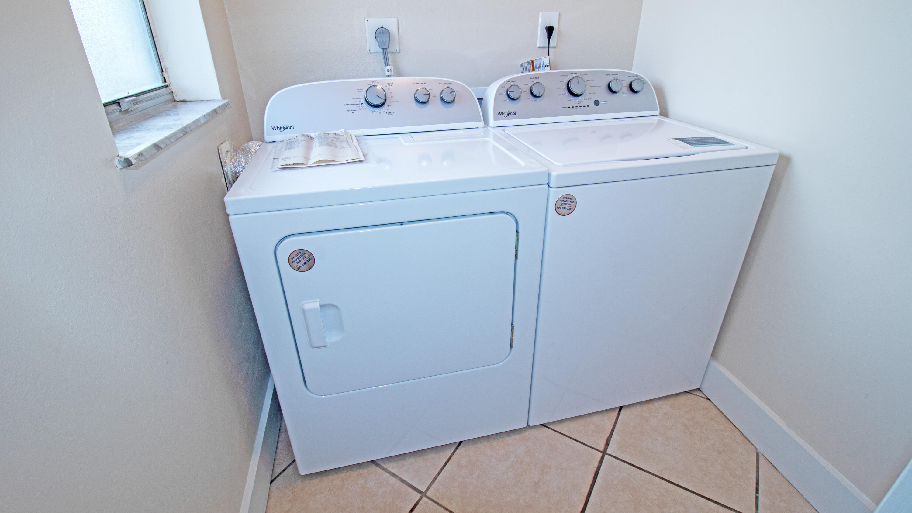 8757 Southeast Hobe Ridge Avenue Hobe Sound, FL 33455 - Photo 16 of 29 a utility room with dryer and washer
