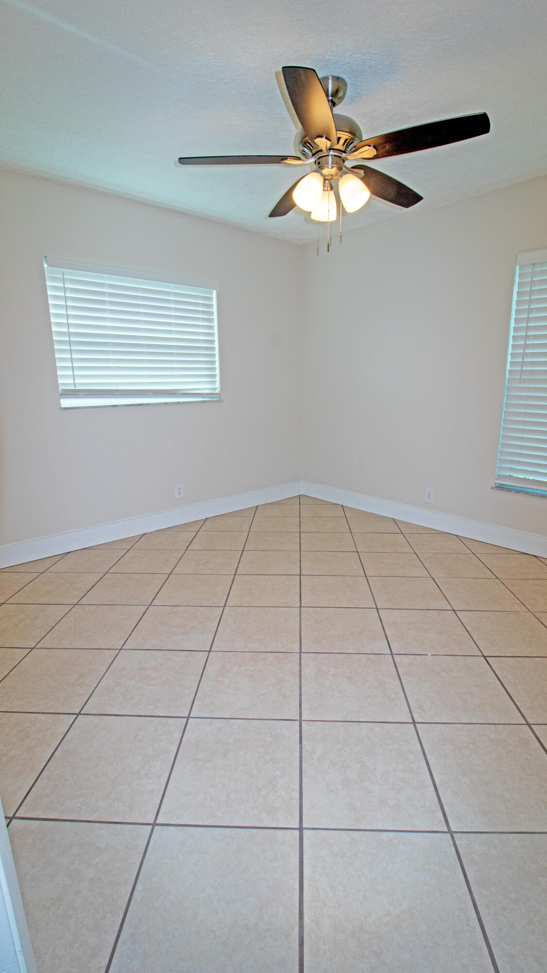 8757 Southeast Hobe Ridge Avenue Hobe Sound, FL 33455 - Photo 22 of 29 a view of an empty room with a window