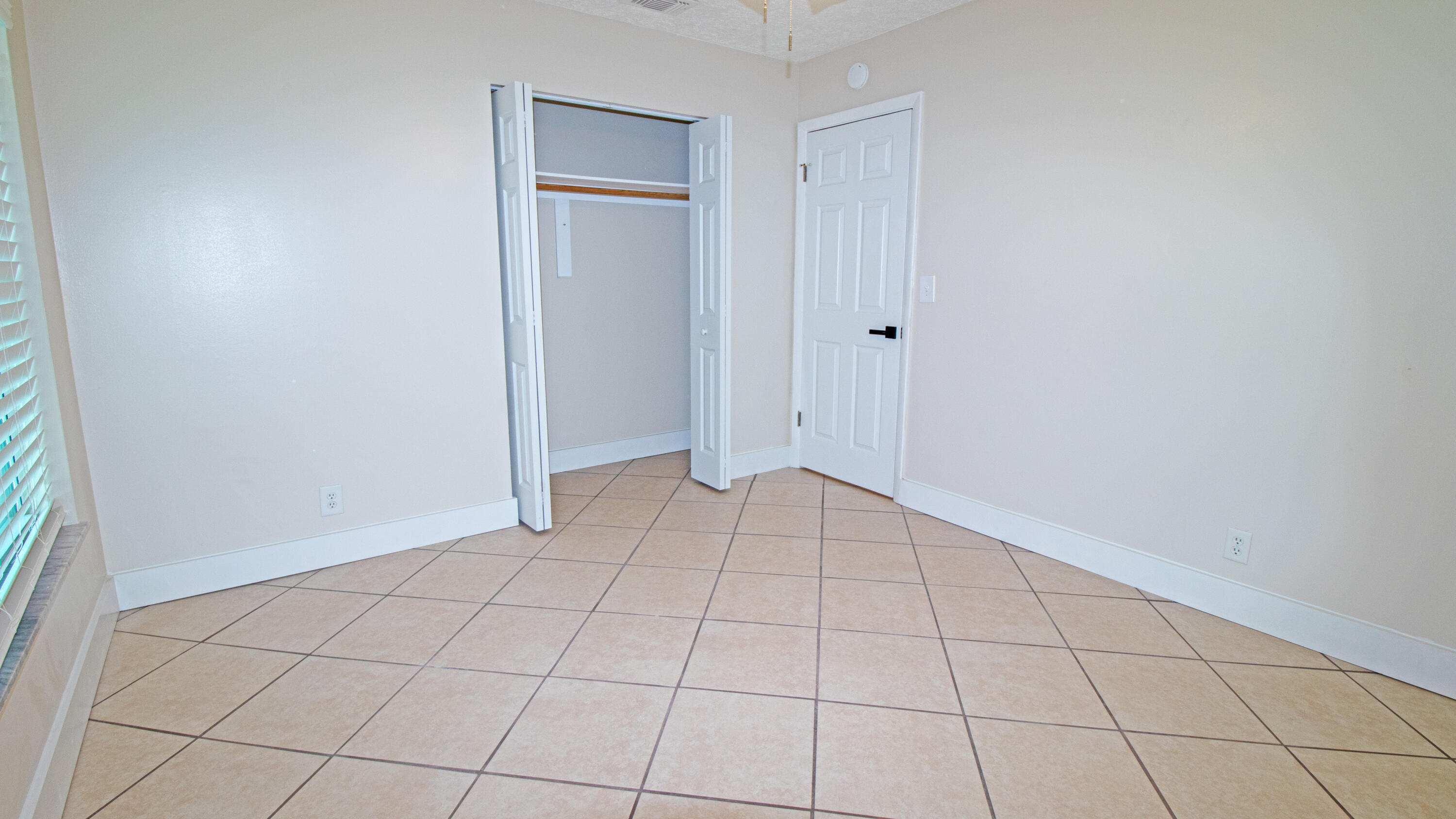 8757 Southeast Hobe Ridge Avenue Hobe Sound, FL 33455 - Photo 23 of 29 a view of an empty room and cabinet