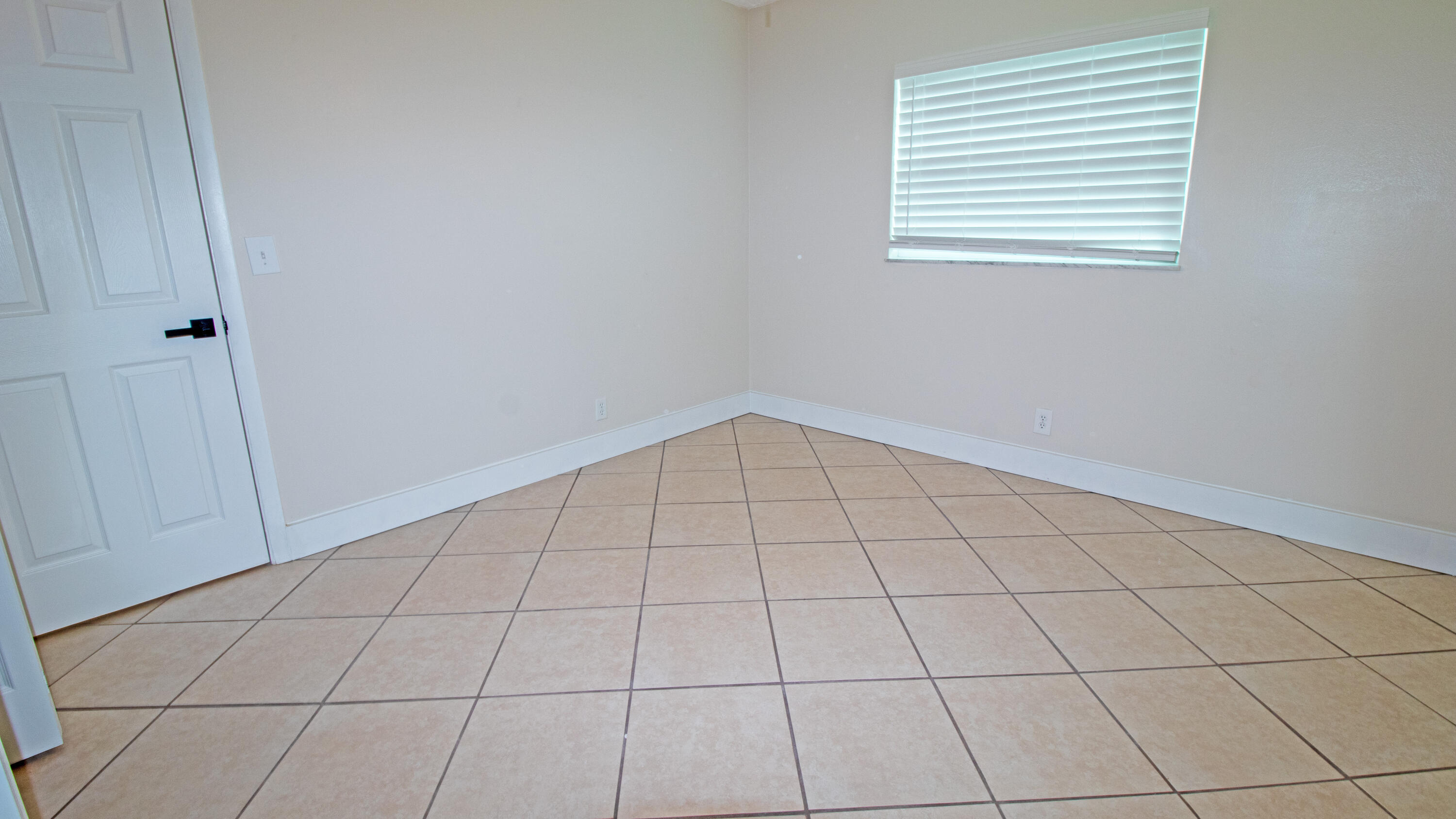 8757 Southeast Hobe Ridge Avenue Hobe Sound, FL 33455 - Photo 24 of 29 a view of an empty room and window