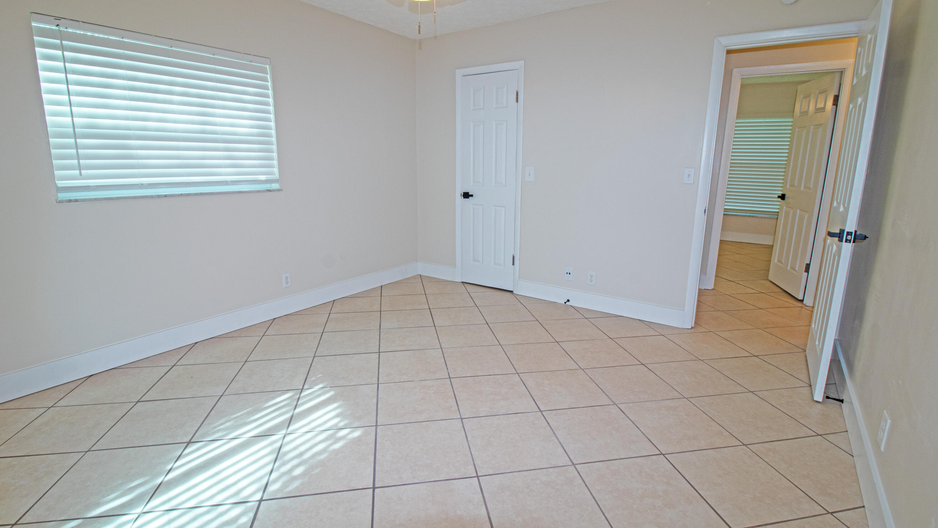 8757 Southeast Hobe Ridge Avenue Hobe Sound, FL 33455 - Photo 26 of 29 a view of an empty room and a window