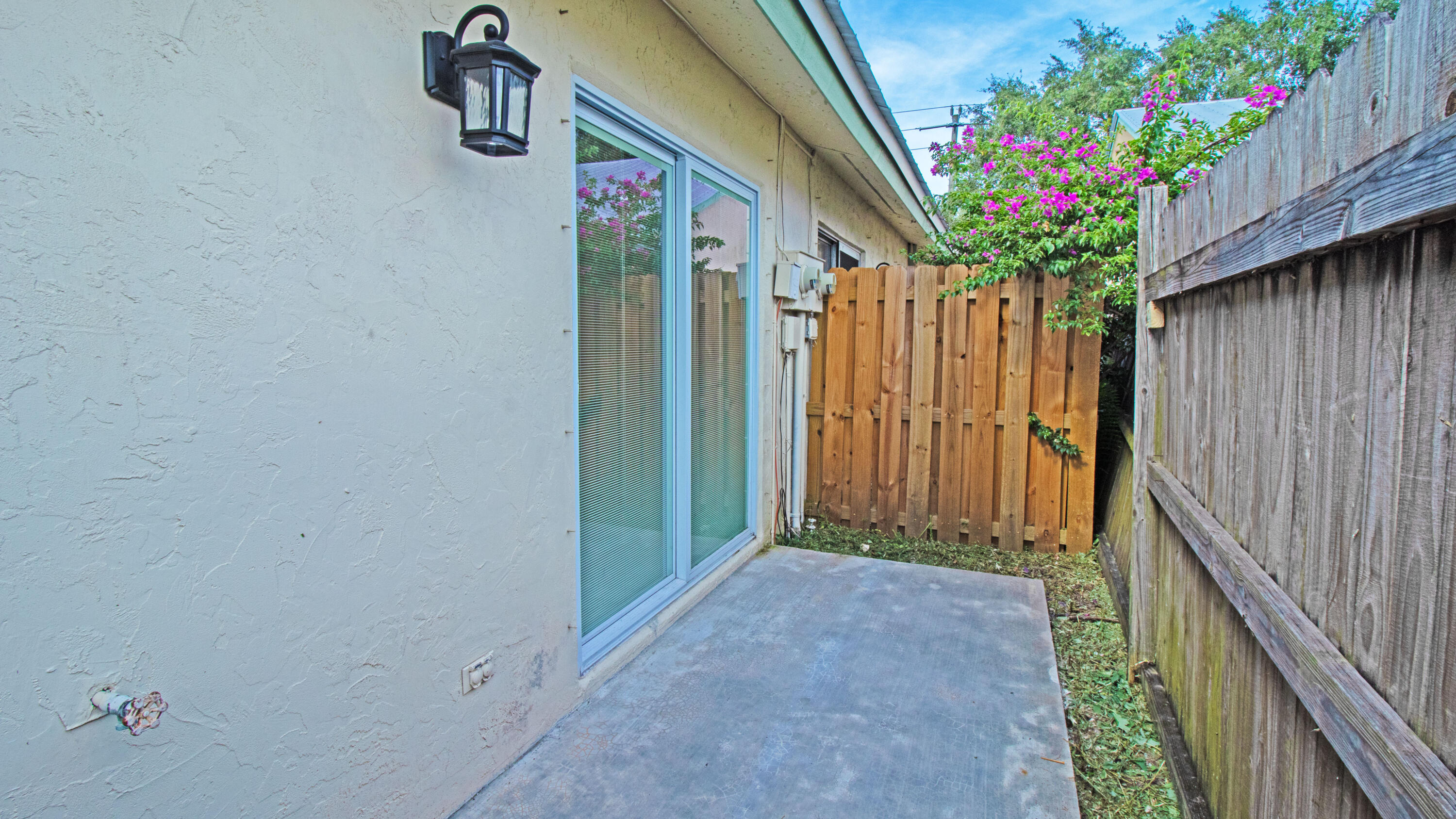 8757 Southeast Hobe Ridge Avenue Hobe Sound, FL 33455 - Photo 29 of 29 a view of a house with a flower garden