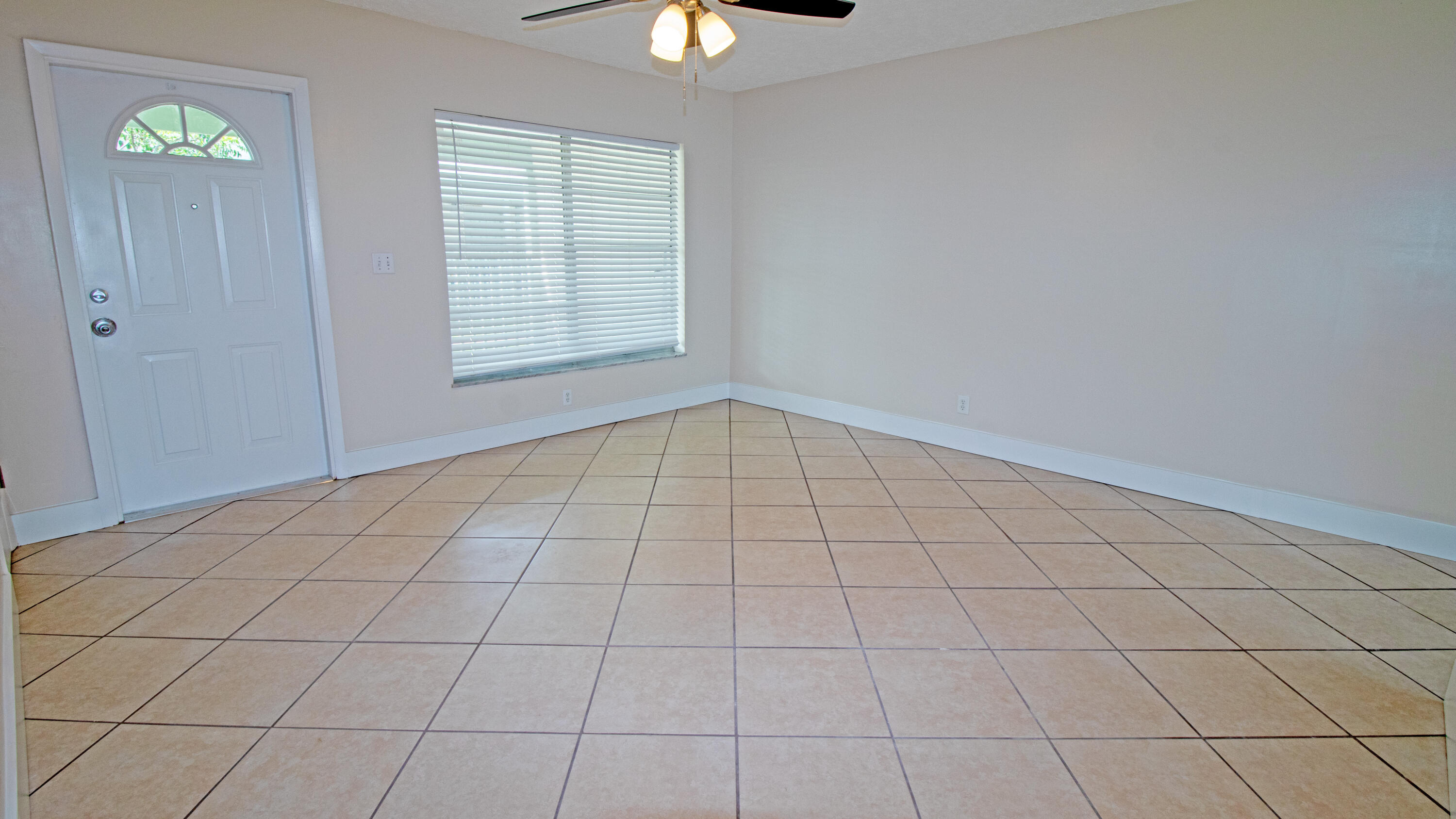 8757 Southeast Hobe Ridge Avenue Hobe Sound, FL 33455 - Photo 5 of 29 a view of an empty room and window