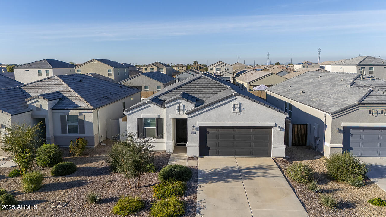 5236 East Emery Road San Tan Valley, AZ 85143 - Photo 1 of 24 front view of a house with a yard