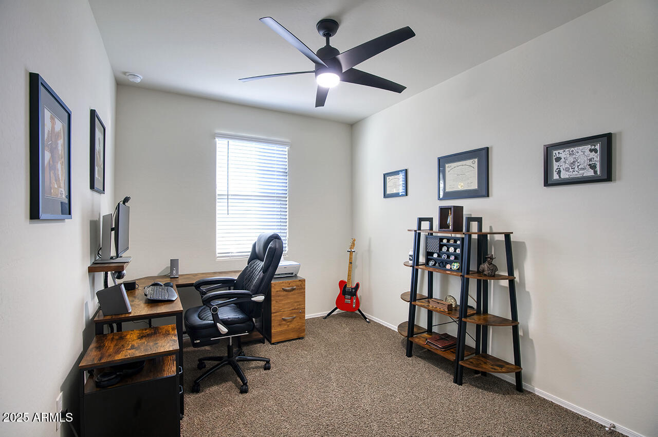 5236 East Emery Road San Tan Valley, AZ 85143 - Photo 10 of 24 a view of a workspace with furniture and a window