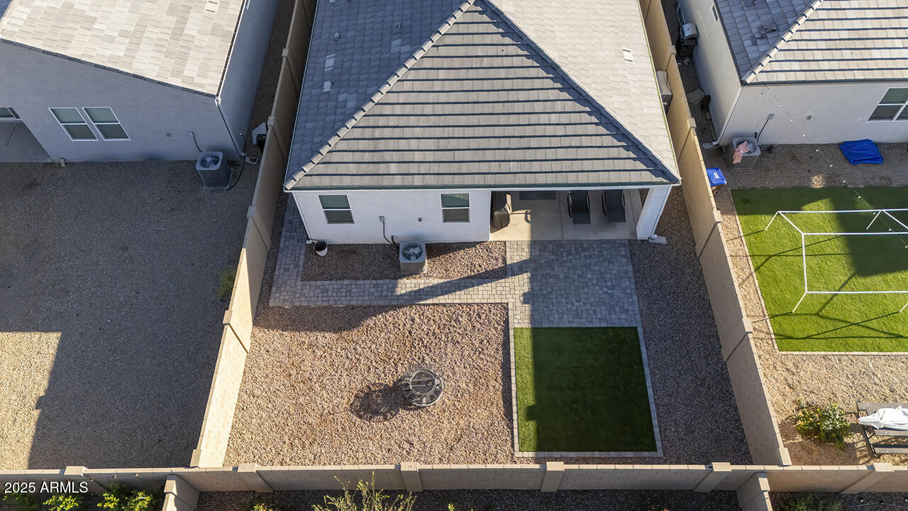5236 East Emery Road San Tan Valley, AZ 85143 - Photo 16 of 24 a view of a house with a balcony wooden fence