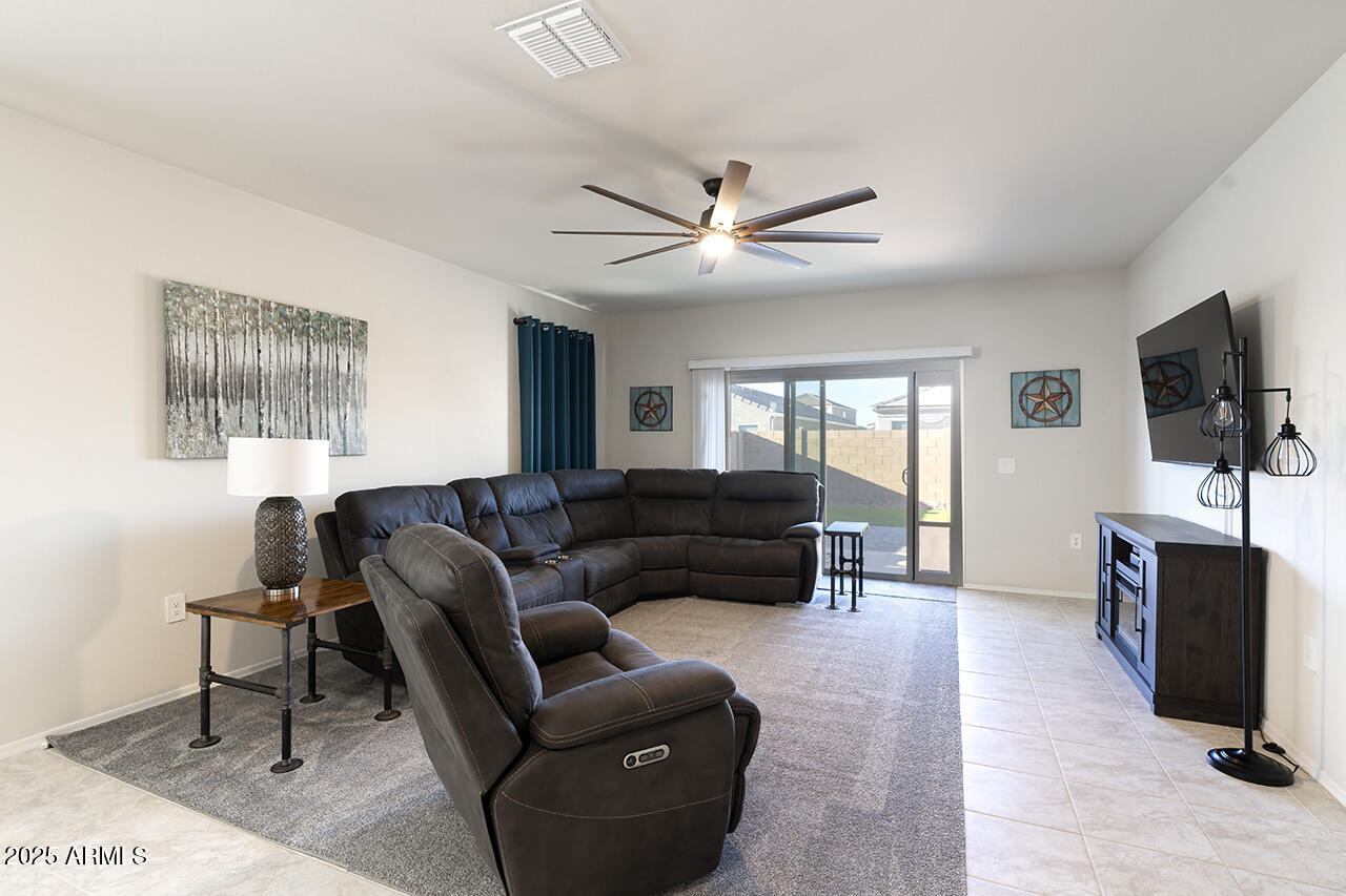 5236 East Emery Road San Tan Valley, AZ 85143 - Photo 7 of 24 a living room with furniture and a flat screen tv