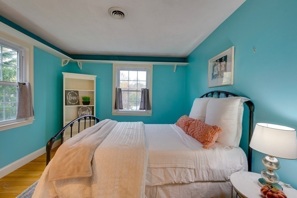 11 Milepost Road Reading, MA 01867 - Photo 14 of 29 a bedroom with a bed and window