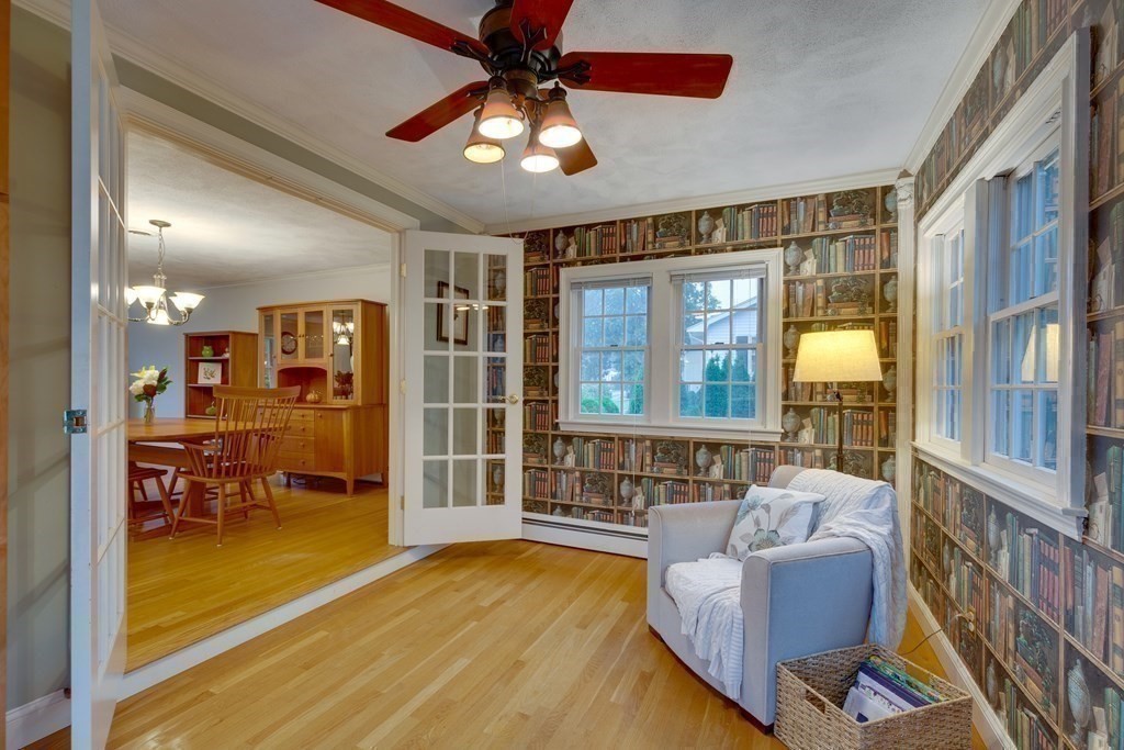 11 Milepost Road Reading, MA 01867 - Photo 17 of 29 a living room with fireplace furniture and a large window