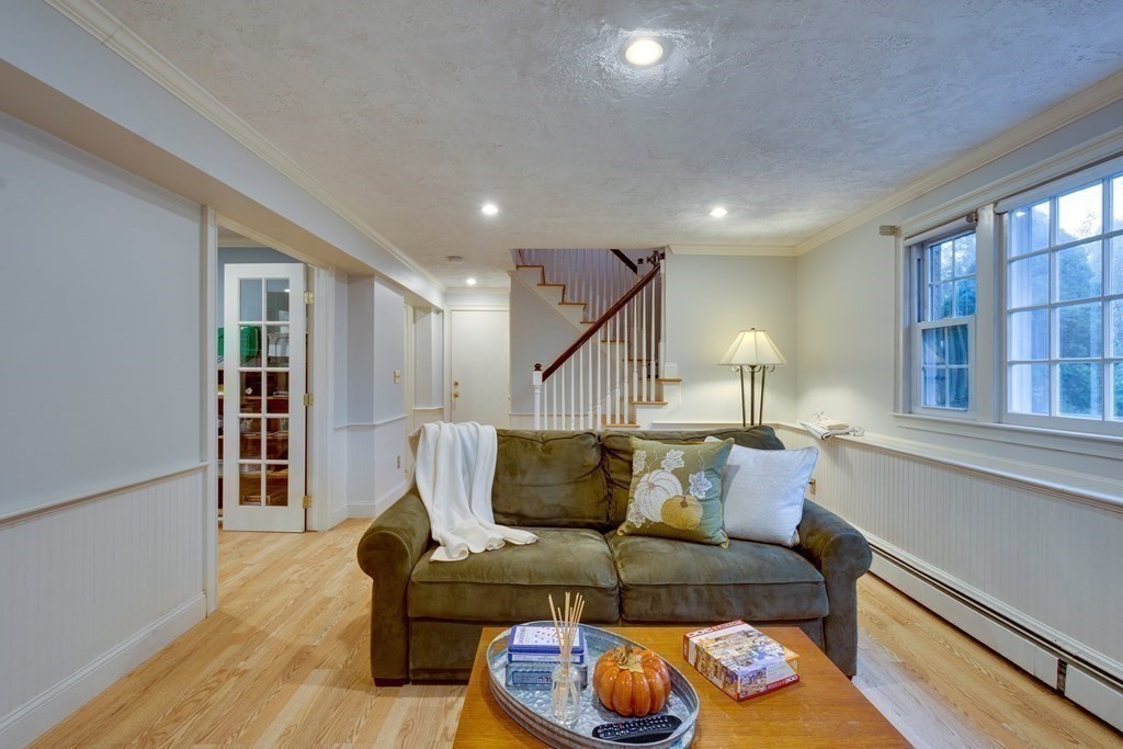 11 Milepost Road Reading, MA 01867 - Photo 21 of 29 a living room with furniture and wooden floor