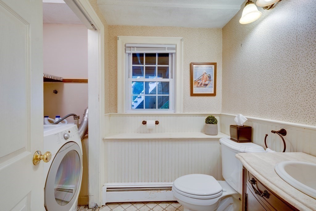 11 Milepost Road Reading, MA 01867 - Photo 24 of 29 a bathroom with a sink vanity mirror and toilet