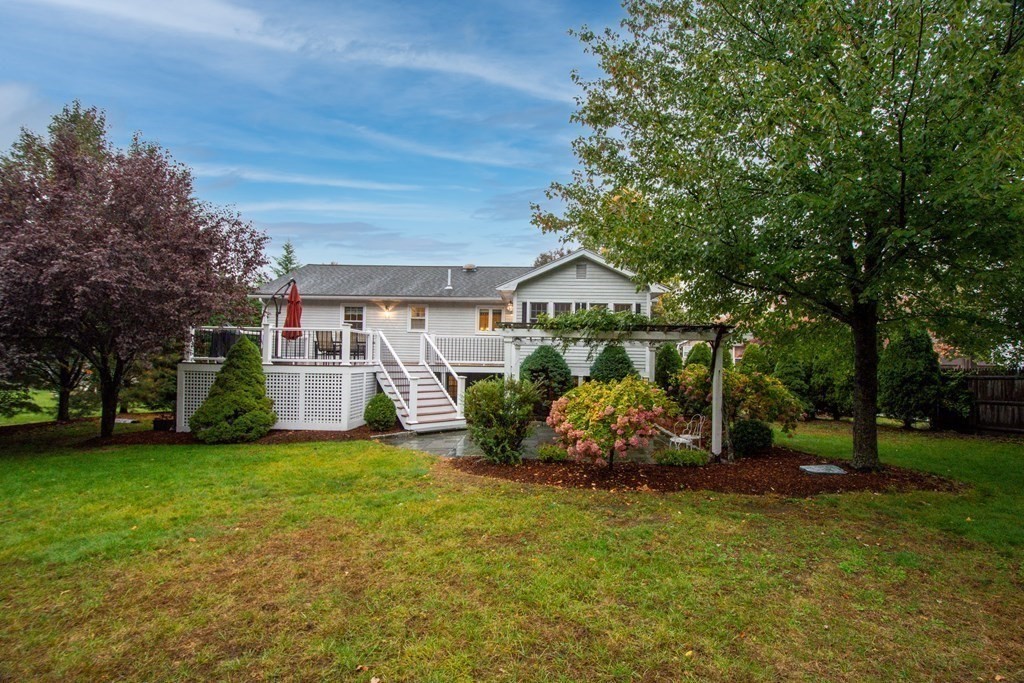11 Milepost Road Reading, MA 01867 - Photo 25 of 29 a front view of a house with garden