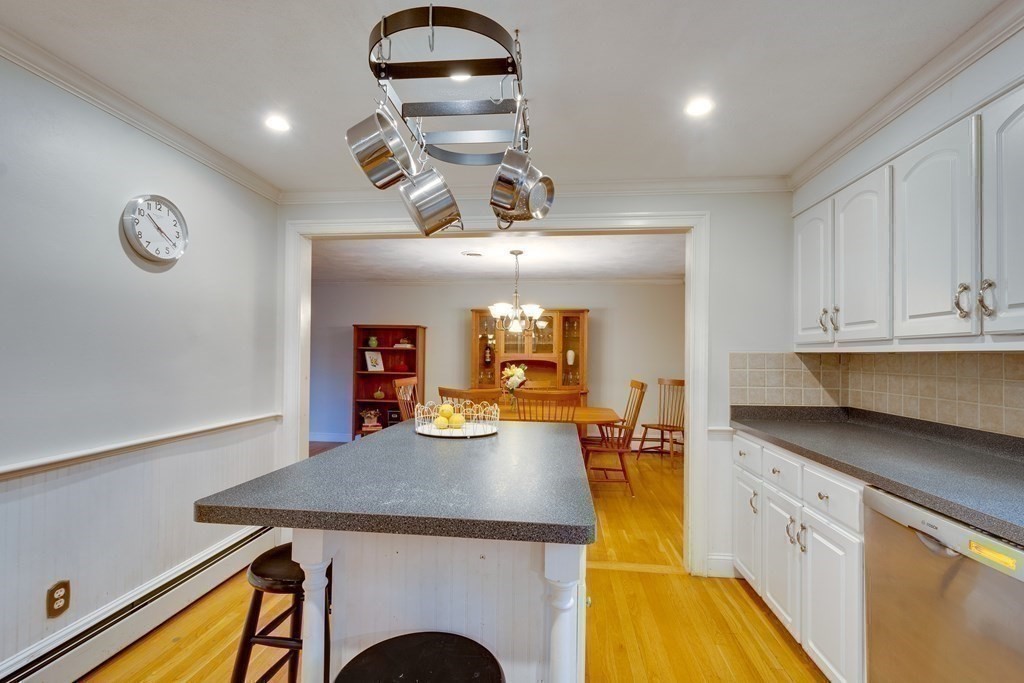 11 Milepost Road Reading, MA 01867 - Photo 9 of 29 a kitchen with a sink a stove and cabinets