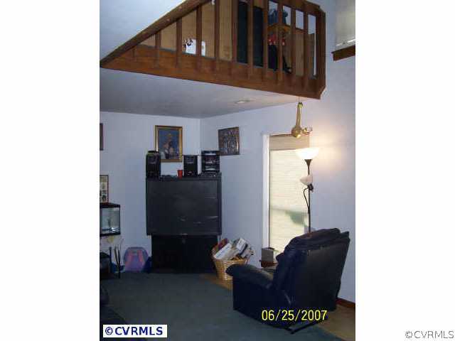 15816 Tri Gate Road Chester, VA 23831 - Photo 5 of 10 a living room with furniture and a window