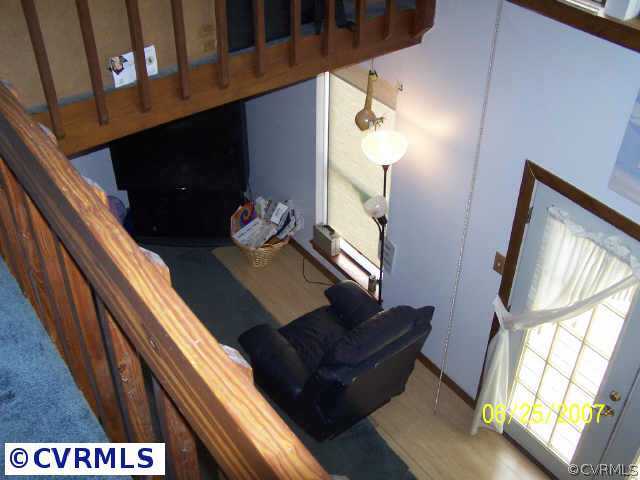 15816 Tri Gate Road Chester, VA 23831 - Photo 10 of 10 a living room with furniture and a fireplace
