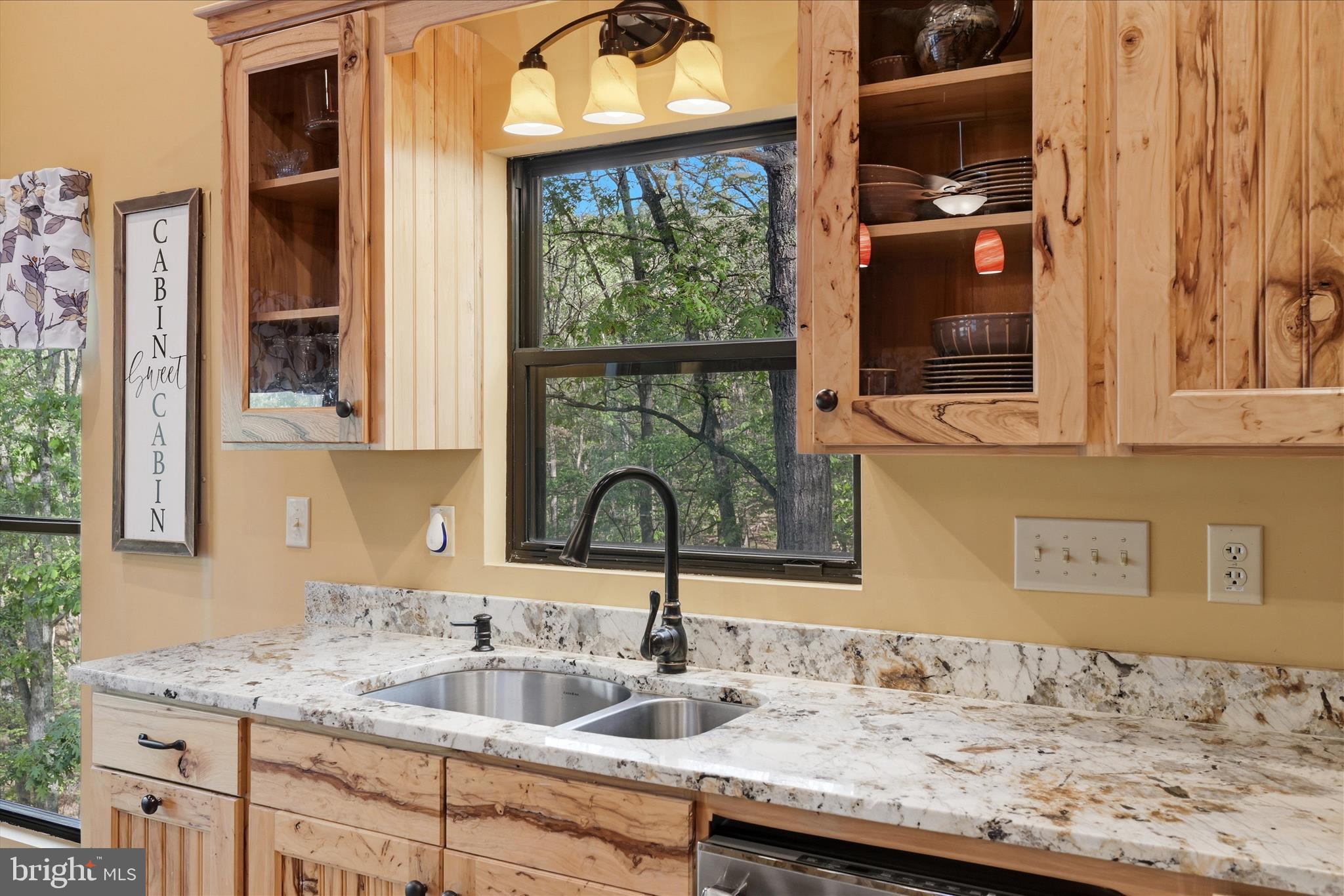 1856 Crossings View Road Paw Paw, WV 25434 - Photo 10 of 45 a bathroom with a granite countertop sink and a window