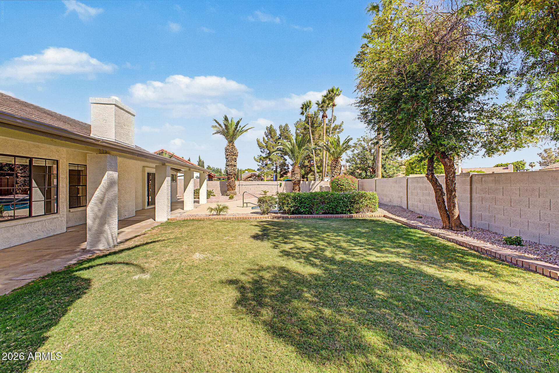 6725 West Utopia Road Glendale, AZ 85308 - Photo 23 of 27 a view of a yard with a house
