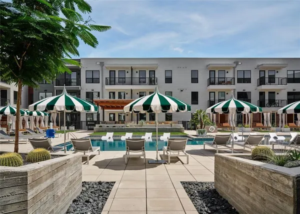 a front view of houses with yard