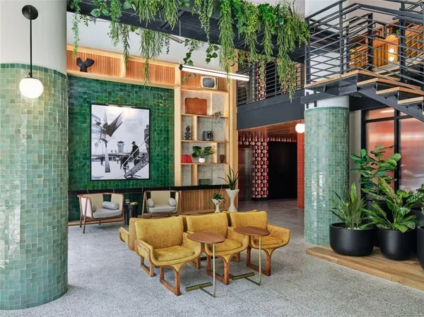 a view of a patio with a table and chairs