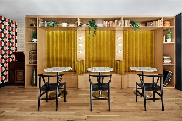 a view of a chairs and table in a room