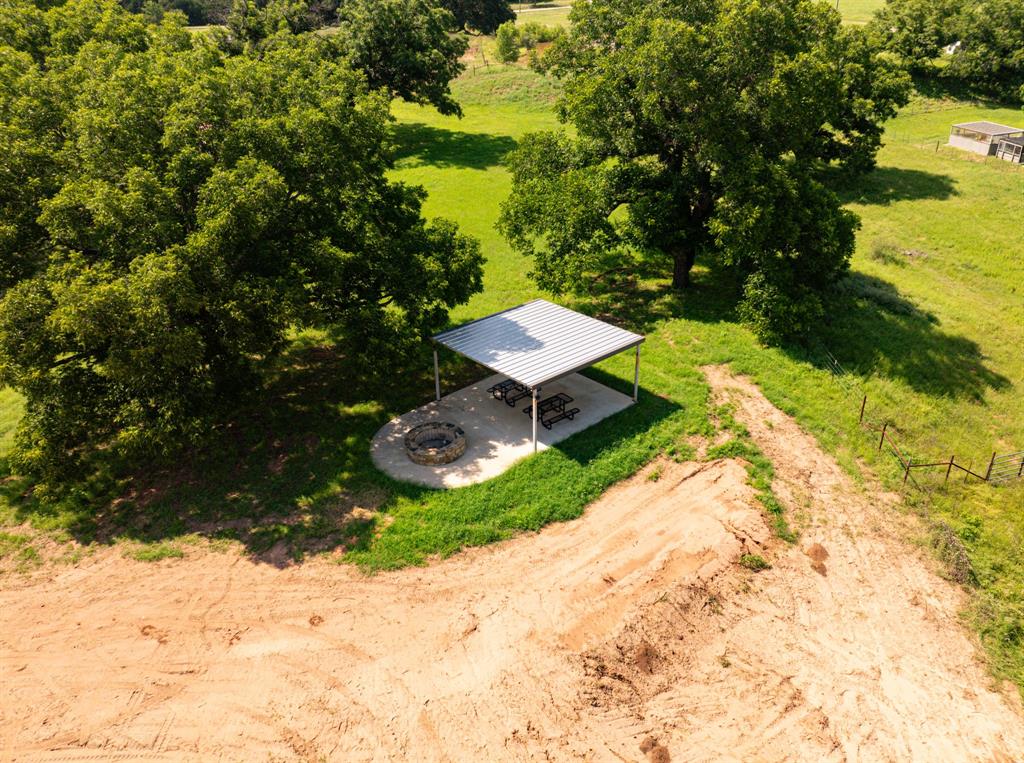2109 River Shls Road Mineral Wells, TX 76067 - Photo 36 of 40 a view of a backyard with a garden