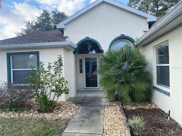 a kitchen with stainless steel appliances granite countertop a sink and a stove
