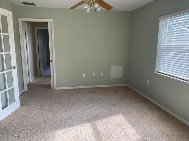 an empty room with windows