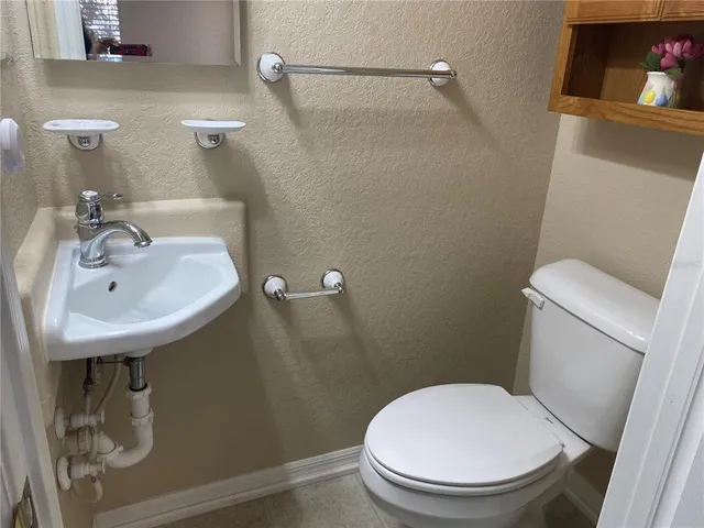 a view of storage and utility room with a window