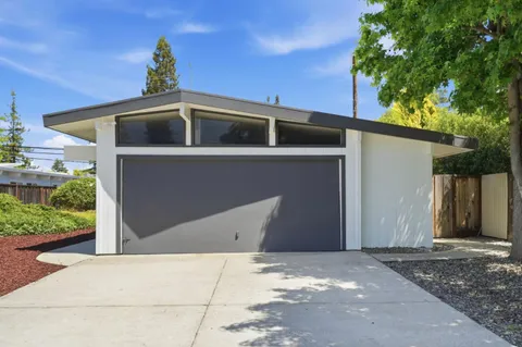 a front view of a house with a garage