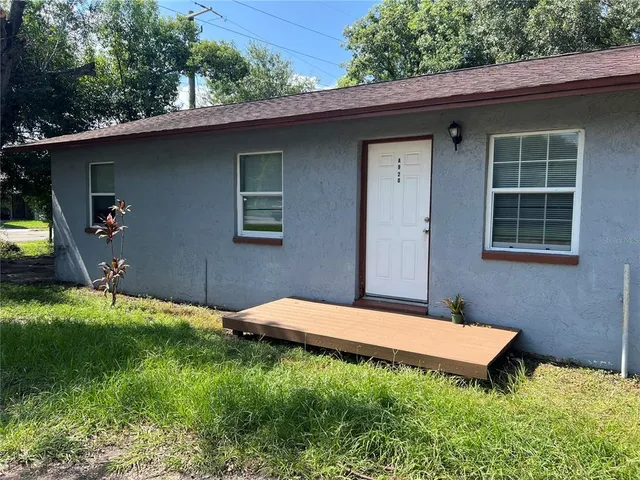 a backyard of a house with seating space