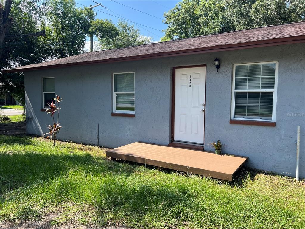 920 Maydell Drive, Unit B Tampa, FL 33619 - Photo 1 of 7 a backyard of a house with seating space