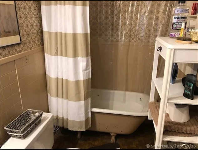 a view of staircase with three beds in wooden floor