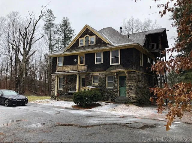 a view of a street with trees on both side of it