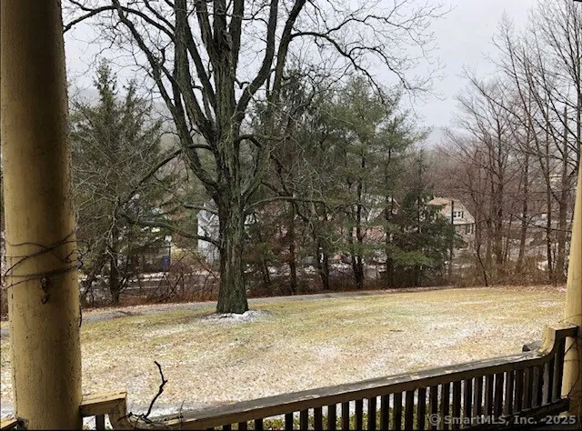 a view of a backyard with trees