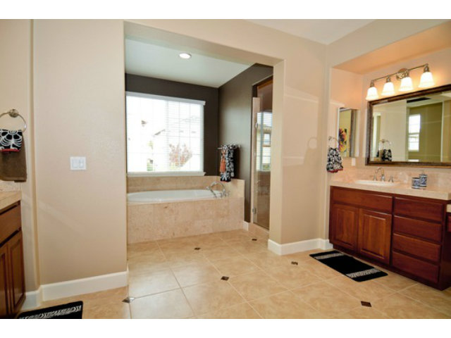 2651 Paige Way San Ramon, CA 94582 - Photo 21 of 24 a bathroom with a sink a large mirror and a bathtub