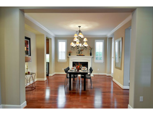 2651 Paige Way San Ramon, CA 94582 - Photo 5 of 24 a dining room with wooden floor a chandelier a wooden table and chairs