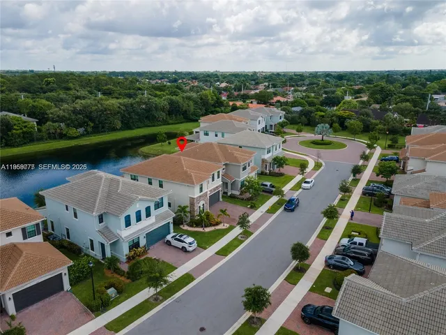 an aerial view of a house with outdoor space