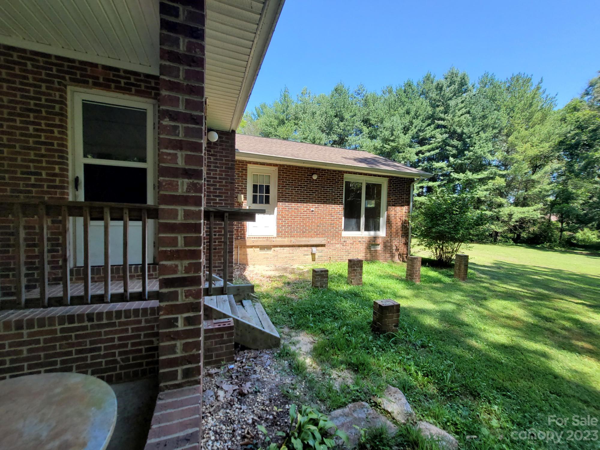 818 St Marks Church Road Bessemer City, NC 28016 - Photo 14 of 48 a backyard of a house with lots of green space