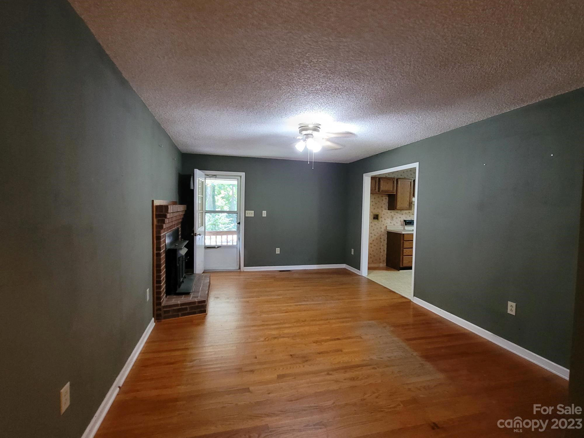 818 St Marks Church Road Bessemer City, NC 28016 - Photo 30 of 48 a view of hallway with wooden floor and a window