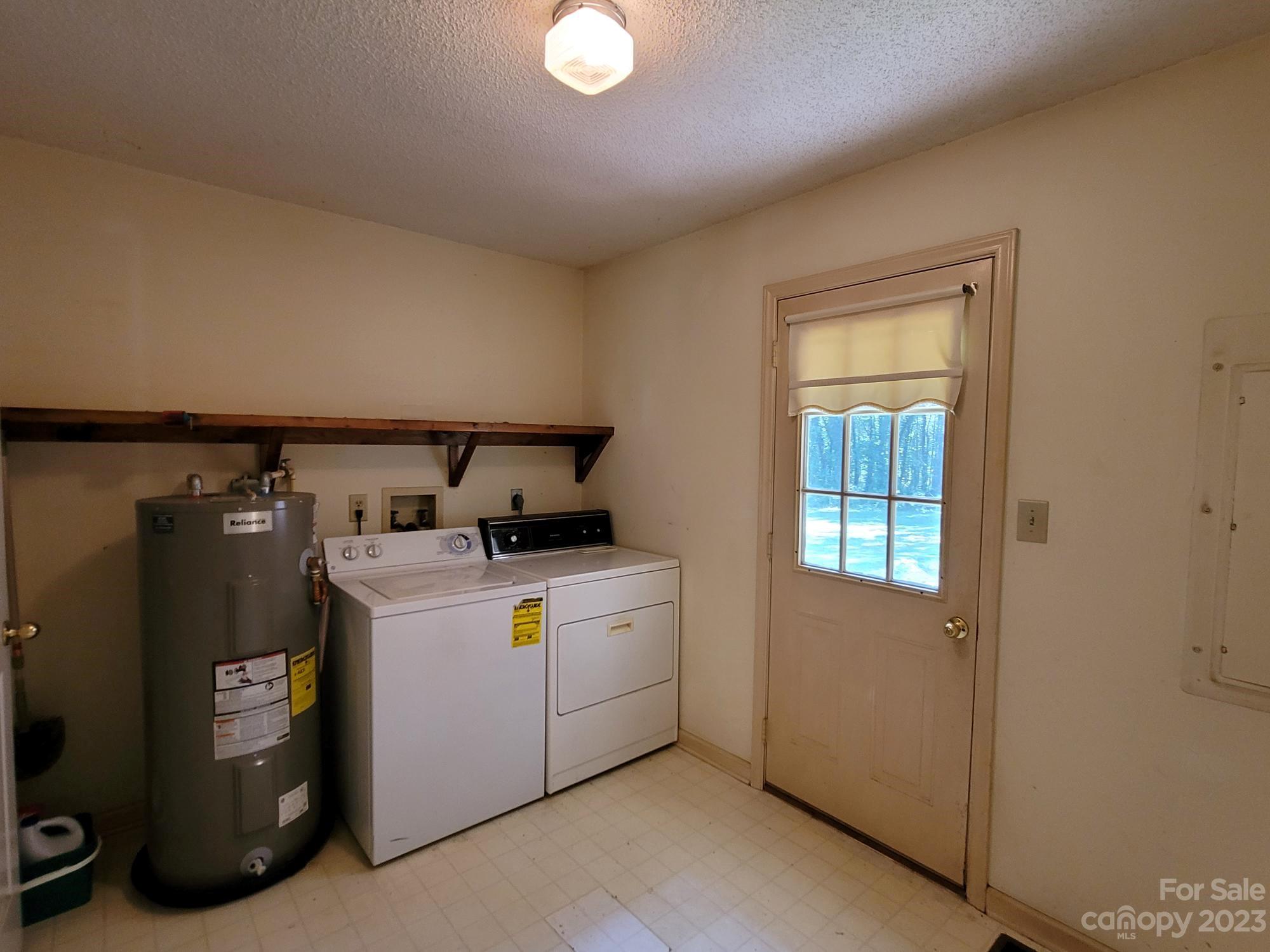 818 St Marks Church Road Bessemer City, NC 28016 - Photo 35 of 48 a utility room with dryer and washer