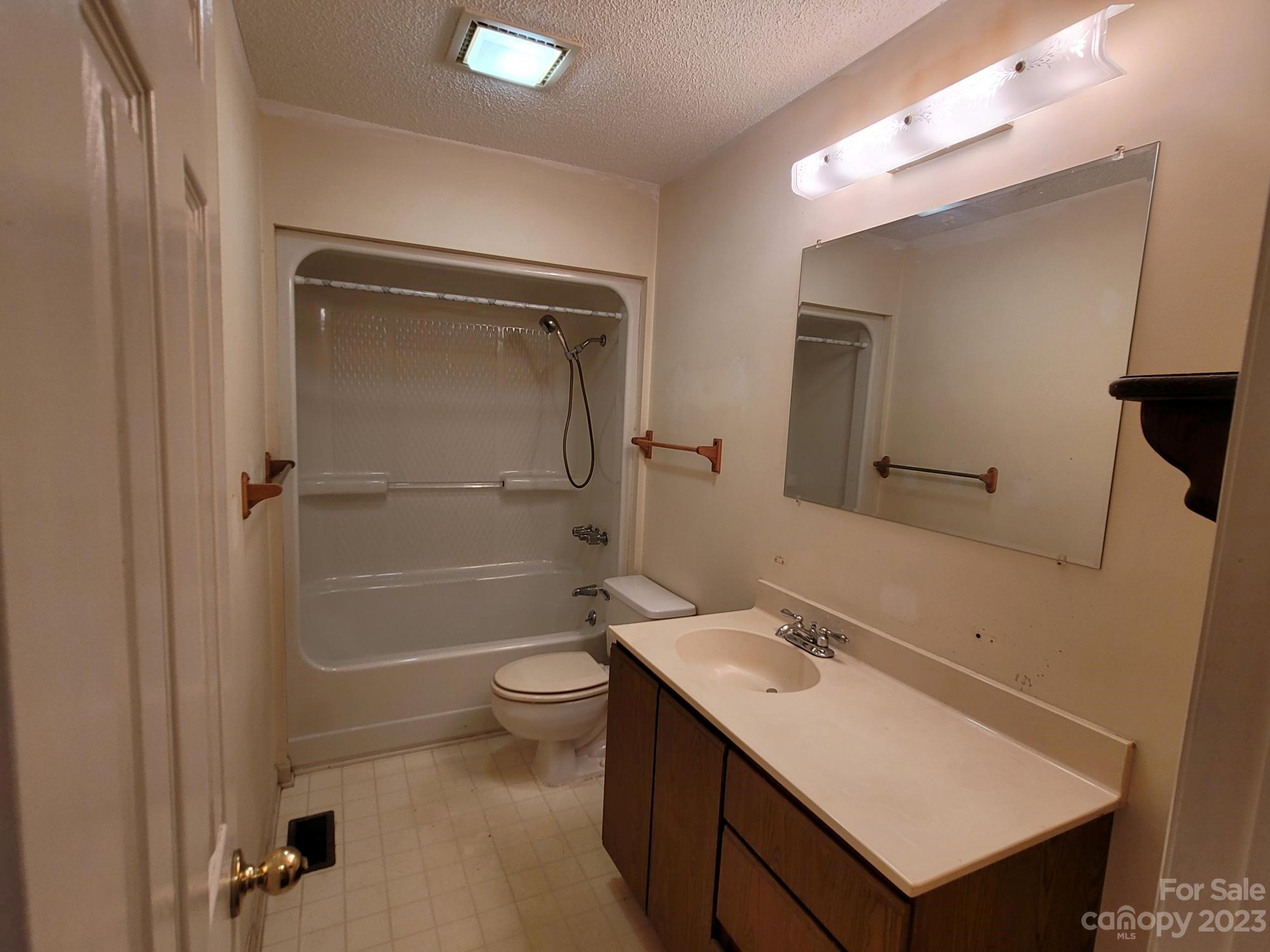 818 St Marks Church Road Bessemer City, NC 28016 - Photo 37 of 48 a bathroom with a sink a toilet and shower