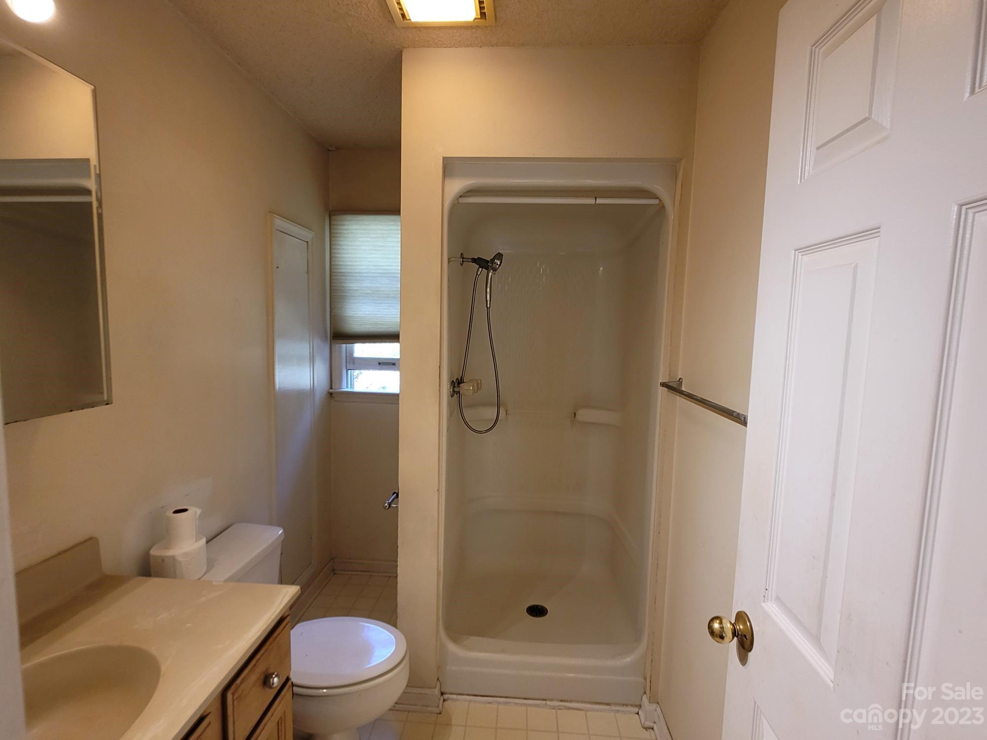 818 St Marks Church Road Bessemer City, NC 28016 - Photo 40 of 48 a bathroom with a granite countertop toilet and a sink