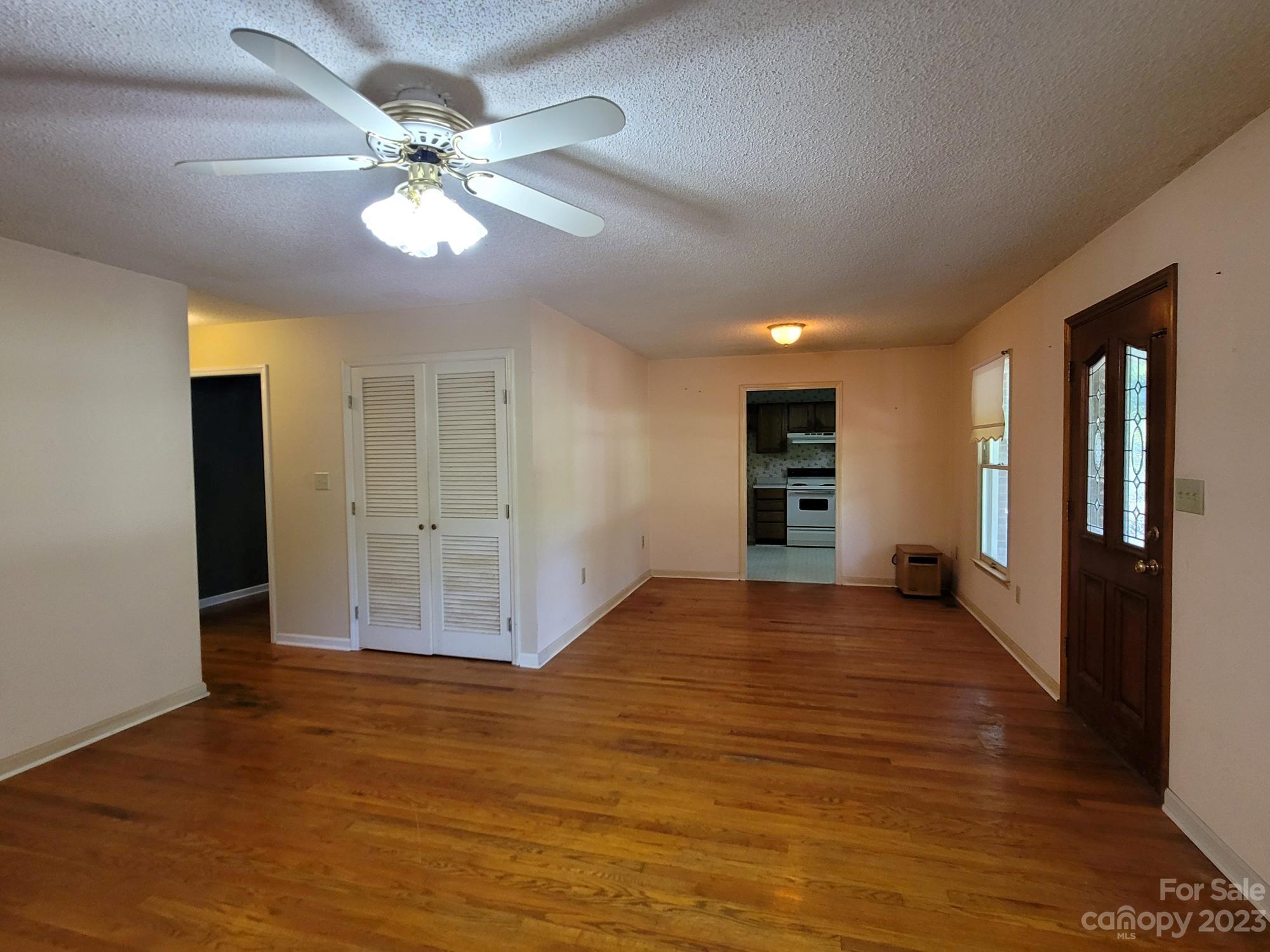 818 St Marks Church Road Bessemer City, NC 28016 - Photo 47 of 48 a view of an empty room with window and wooden floor